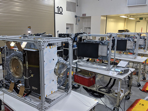 The four PUNCH spacecraft, in their aluminum 
			handling fixtures, are lined up undergoing checkouts before final integration and launch (planned no earlier 
			than 27-Feb-2025).